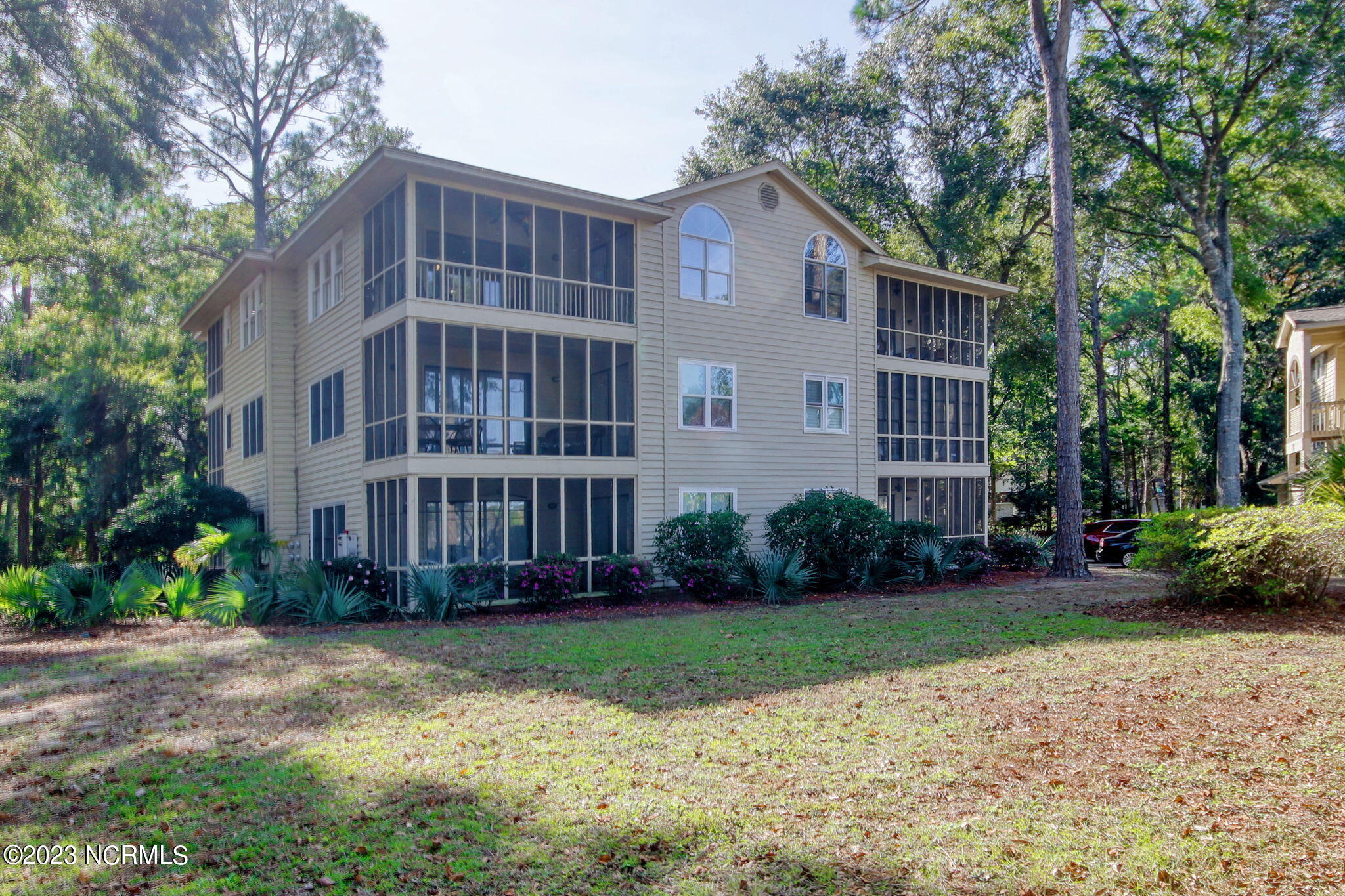 225 Clubhouse Road, Unit 706 Sunset Beach, NC 28468 - Photo 21 of 37 Attractive design of the back of this condominium building!