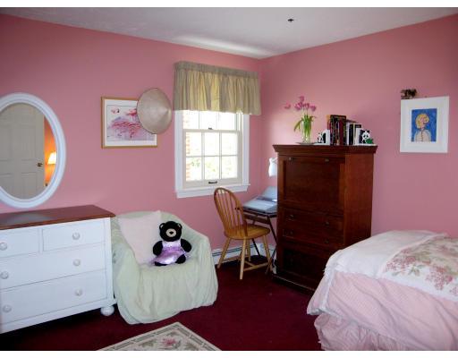 32 Pontiac Road Newton, MA 02468 - Photo 5 of 9 a bedroom with a bed and wooden floor