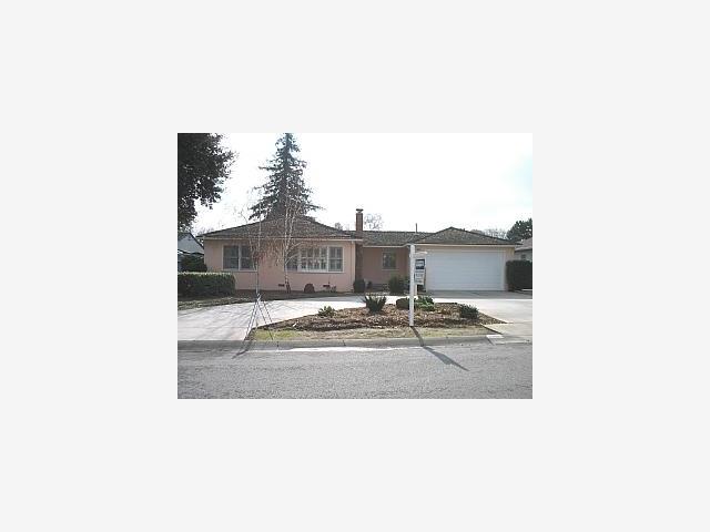 a picture of a living room with a chair