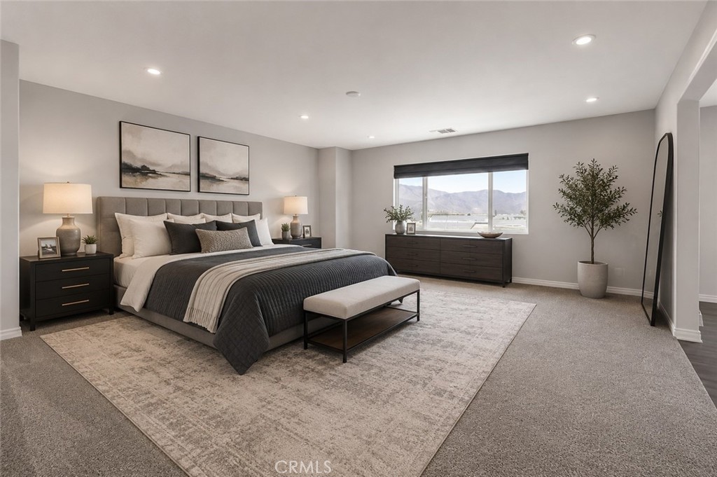11056 Guffey Ranch Way Corona, CA 92883 - Photo 25 of 61 a bedroom with a large bed and a couch