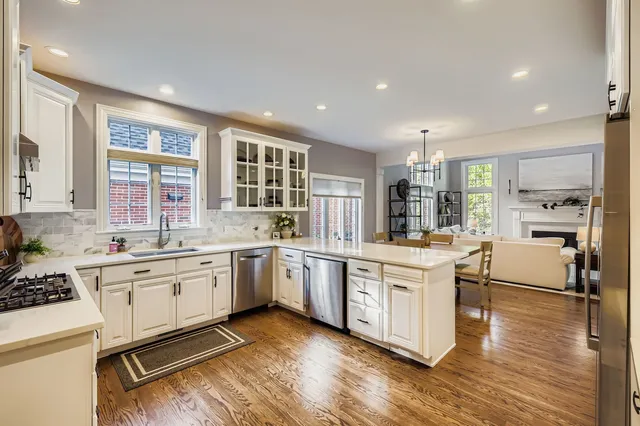 a kitchen with stainless steel appliances granite countertop a stove and cabinets