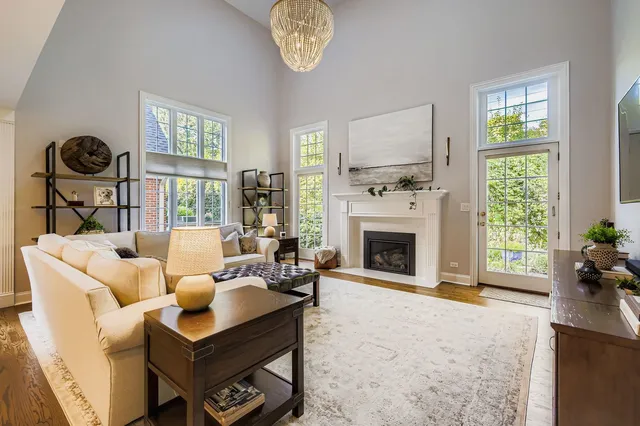 a living room with furniture a window and a fireplace