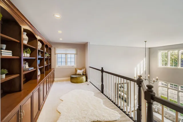 a view of an entryway with wooden floor
