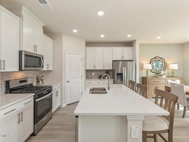 a kitchen with counter space cabinets and appliances