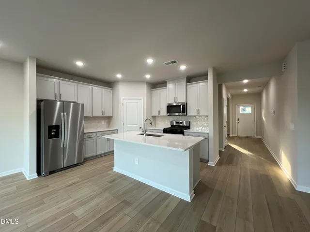 a view of hallway with wooden floor