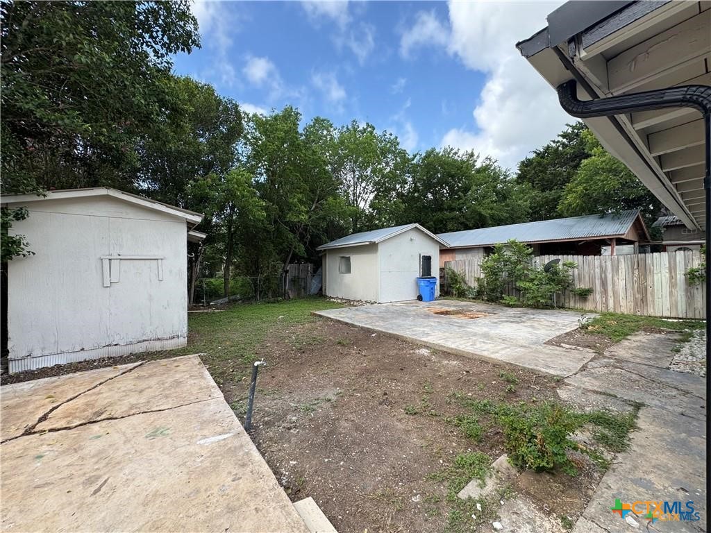 1209 Raymond Street Seguin, TX 78155 - Photo 11 of 11 a view of a house with a yard and garage