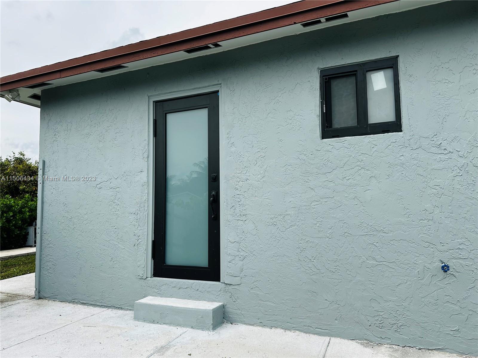26232 Southwest 124th Place Homestead, FL 33032 - Photo 14 of 33 a front view of a house