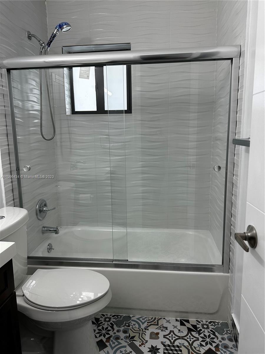26232 Southwest 124th Place Homestead, FL 33032 - Photo 18 of 33 a bathroom with a sink toilet and shower