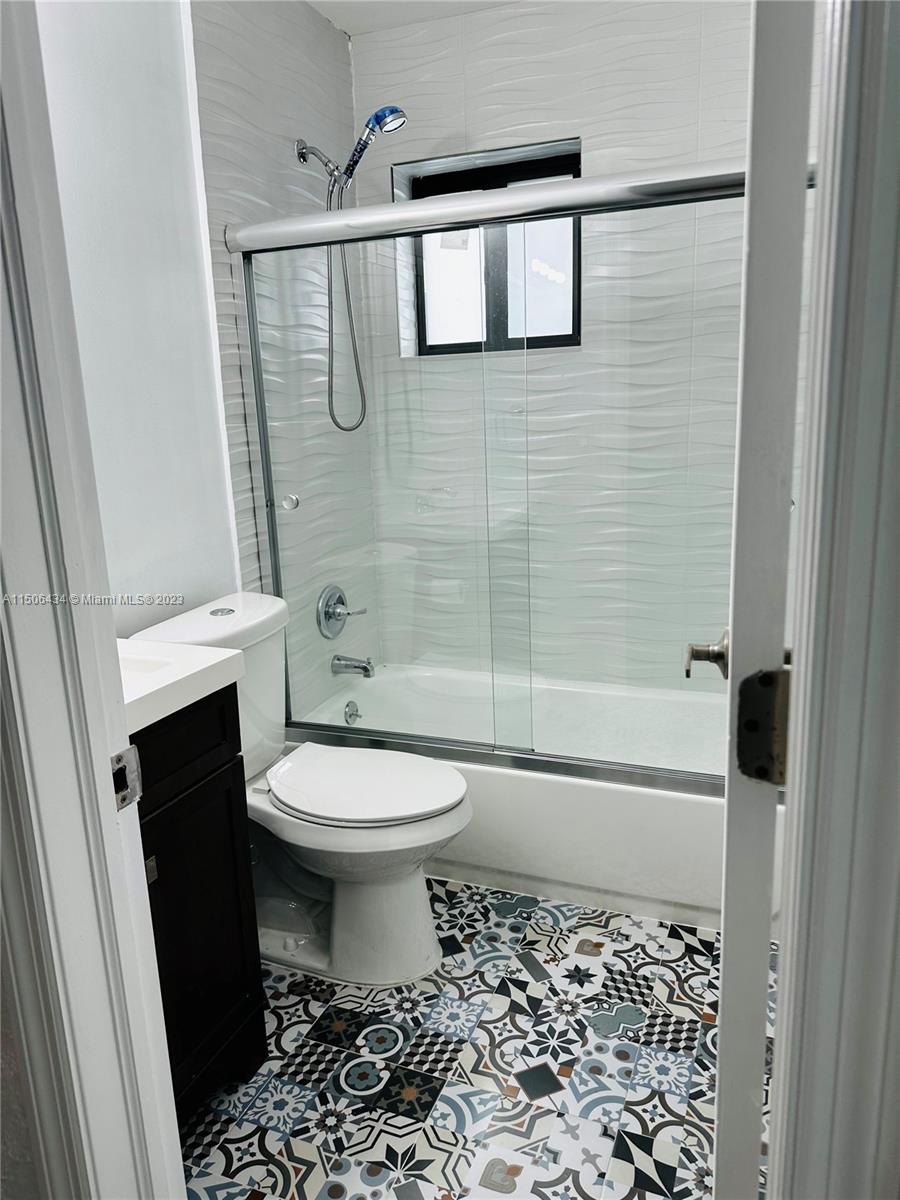 26232 Southwest 124th Place Homestead, FL 33032 - Photo 19 of 33 a bathroom with a toilet and a shower