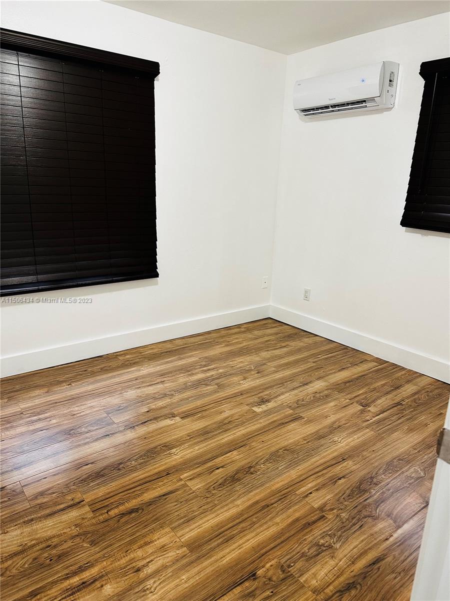 26232 Southwest 124th Place Homestead, FL 33032 - Photo 23 of 33 a view of a room with wooden floor