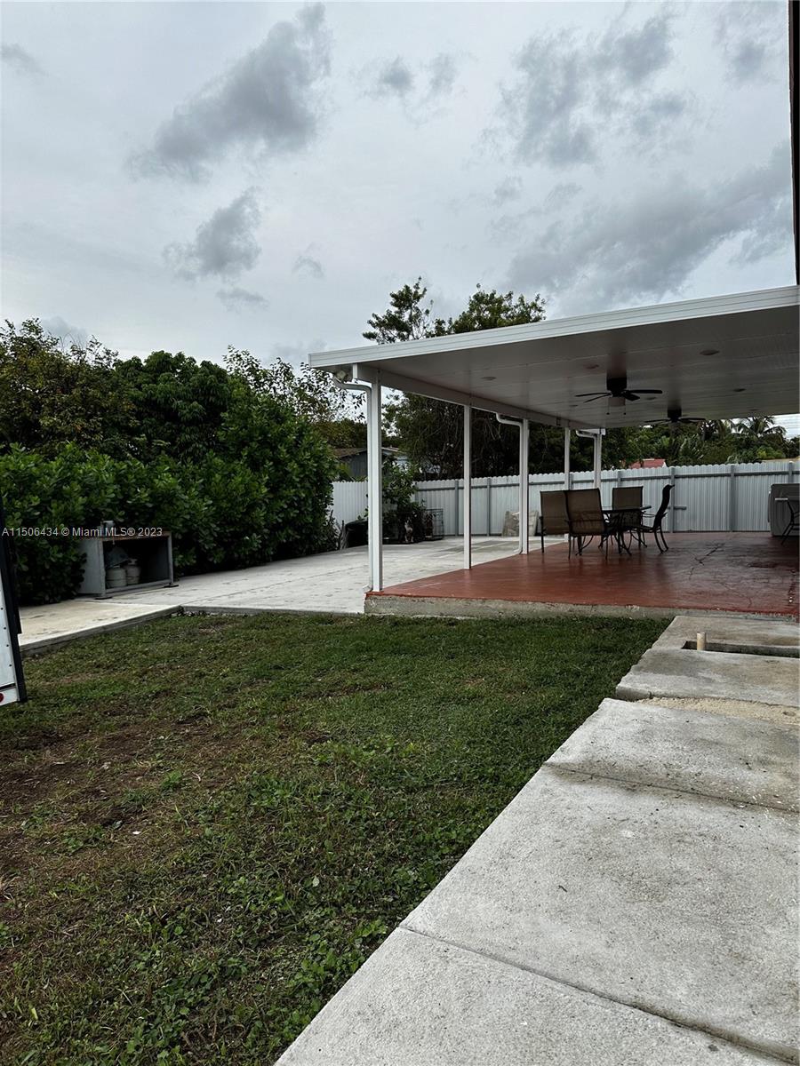 26232 Southwest 124th Place Homestead, FL 33032 - Photo 28 of 33 a view of a house with a backyard