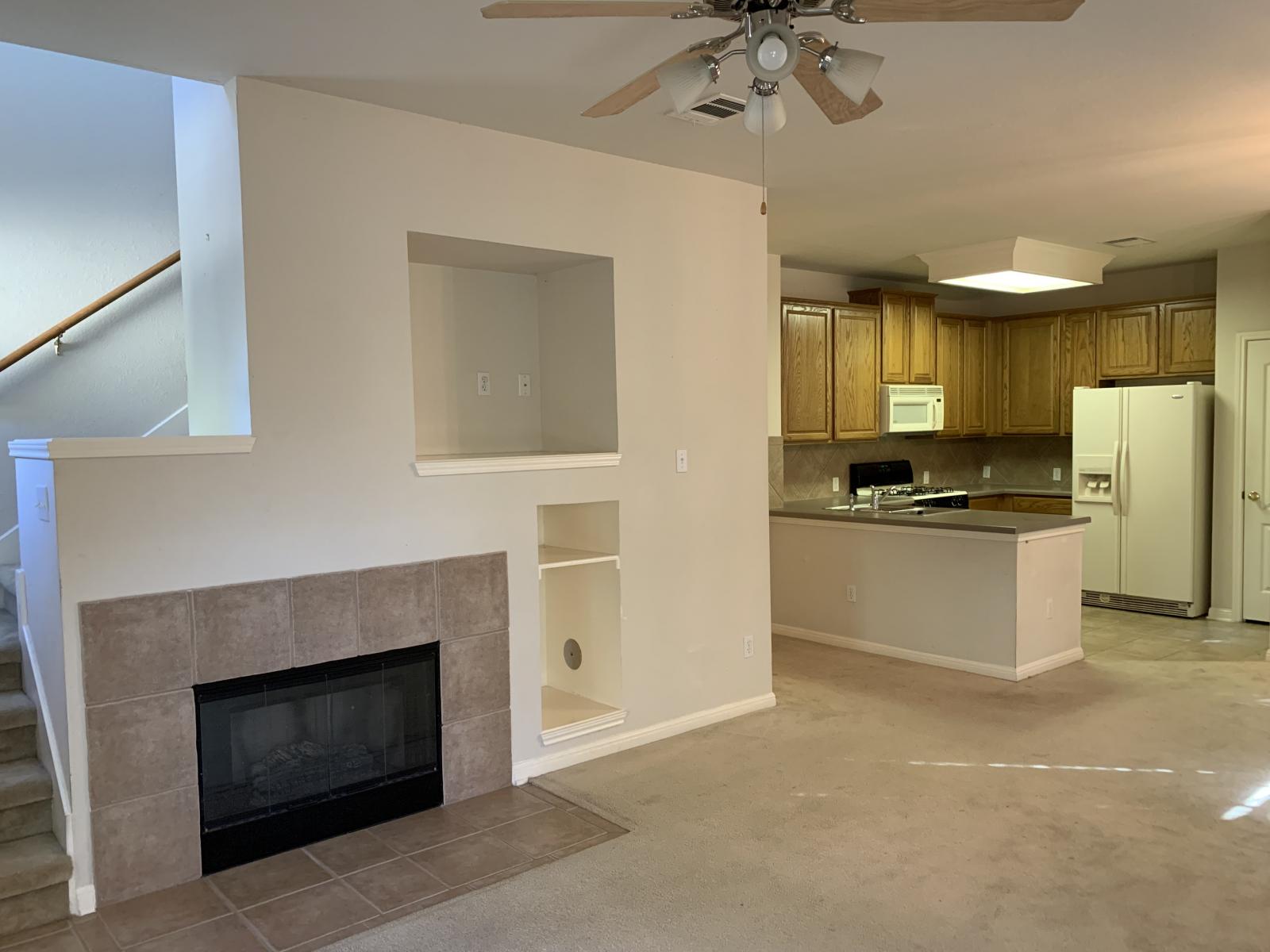 11000 Anderson Mill Road, Unit 29 Austin, TX 78750 - Photo 25 of 27 a kitchen with a refrigerator and a stove top oven