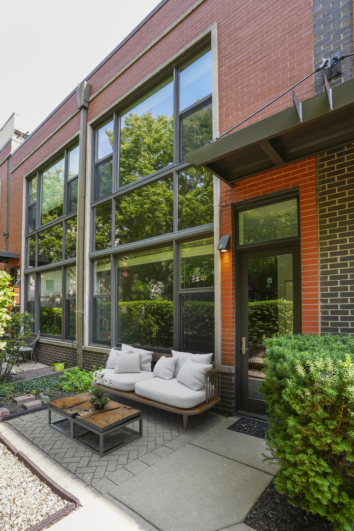 915 North Howe Street Chicago, IL 60610 - Photo 1 of 30 a backyard of a house with outdoor seating