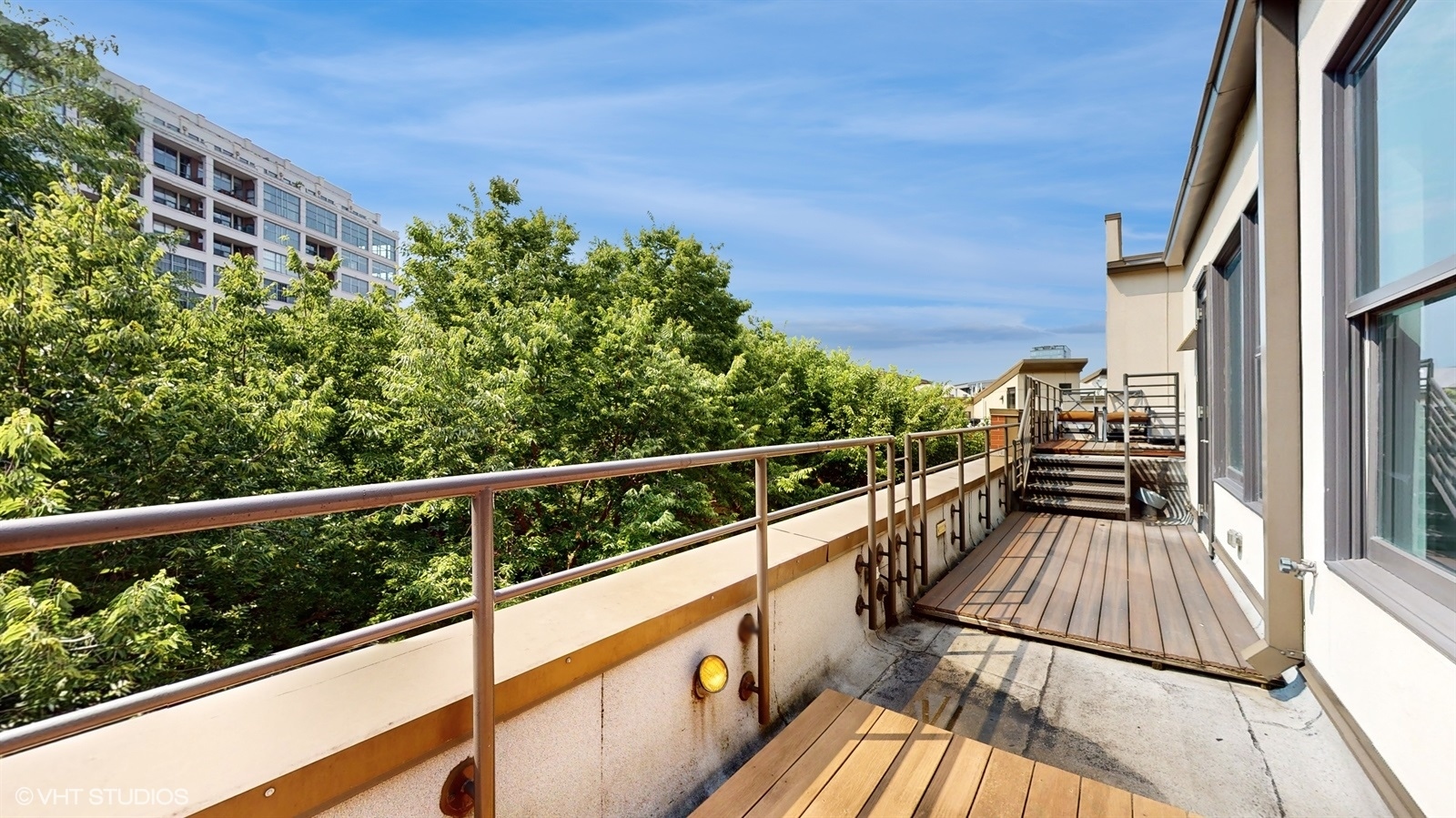 915 North Howe Street Chicago, IL 60610 - Photo 17 of 30 a view of balcony with wooden floor and fence