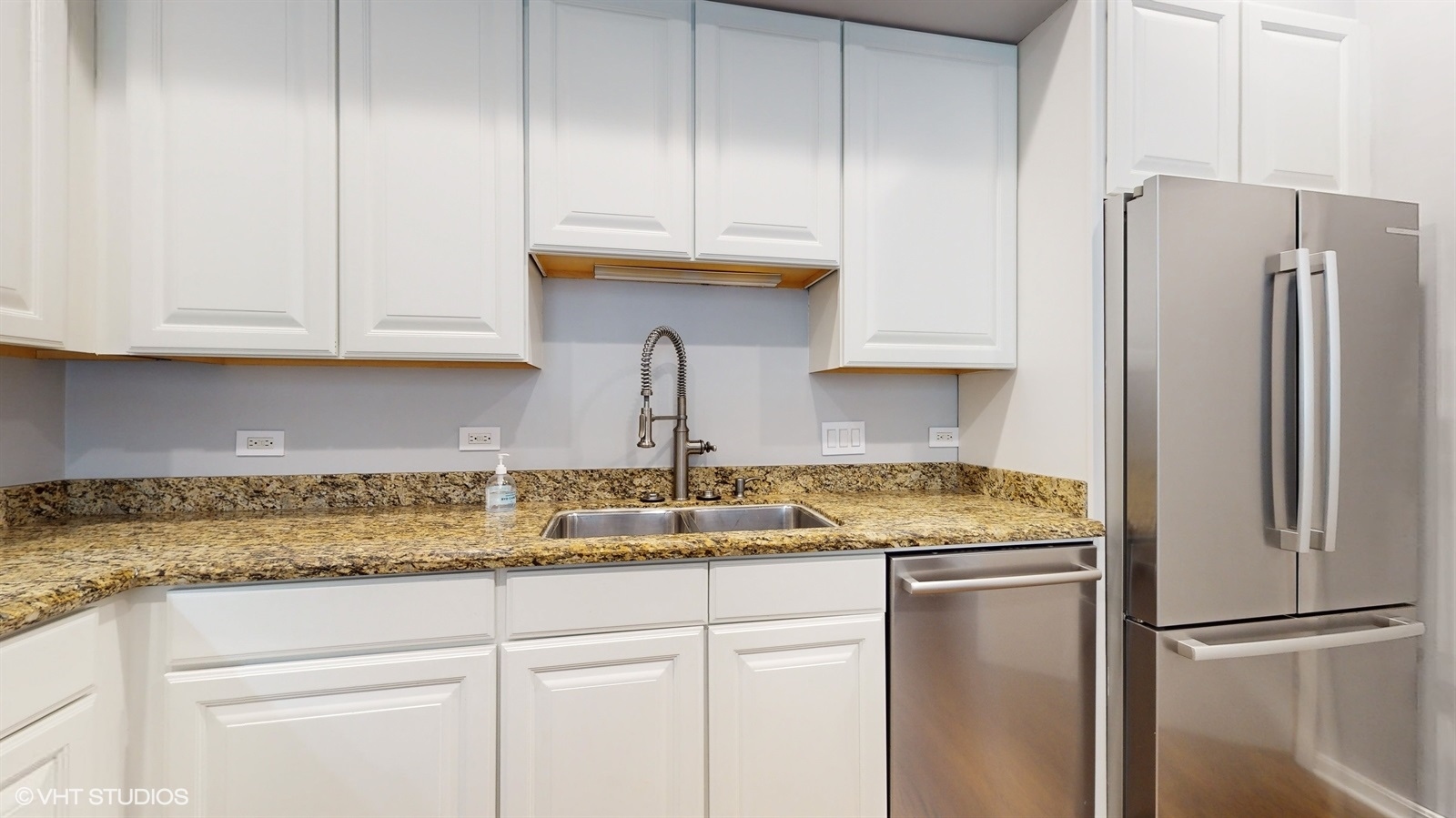 915 North Howe Street Chicago, IL 60610 - Photo 9 of 30 a kitchen with stainless steel appliances granite countertop a refrigerator a stove a sink and dishwasher
