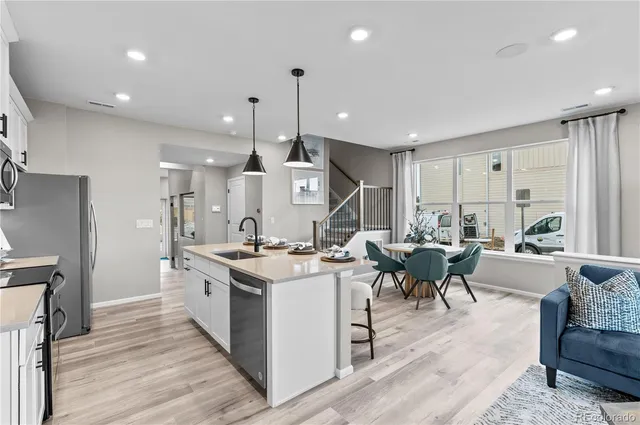a open kitchen with stainless steel appliances granite countertop a stove and cabinets