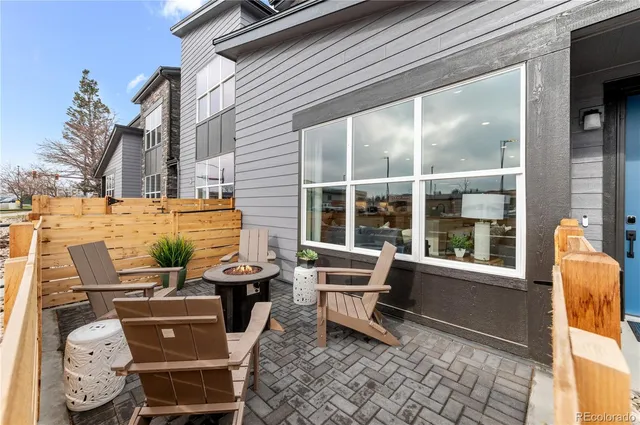 a outdoor space with patio the couches and a potted plant on a table
