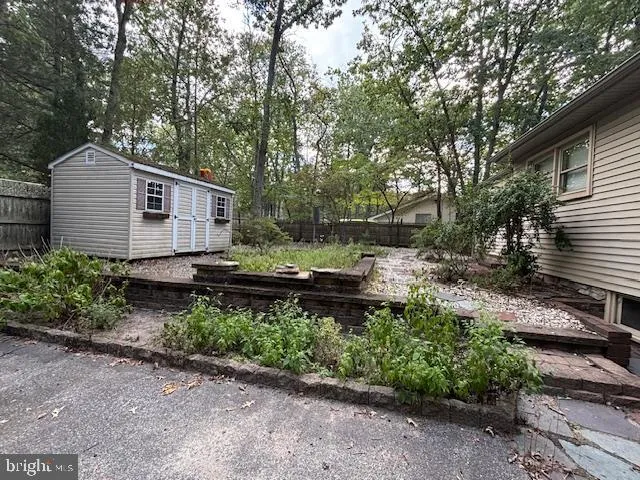 a backyard of a house with a yard and outdoor seating