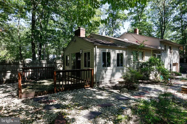 a view of house with a tree