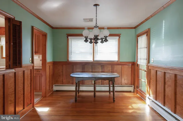 a view of a room with furniture window and wooden floor
