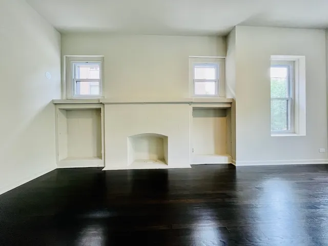 a kitchen with stainless steel appliances a refrigerator a stove top oven a sink and dishwasher