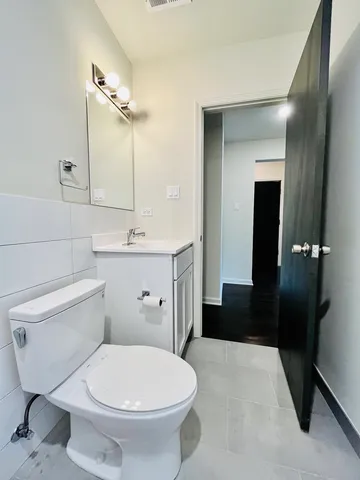 a bathroom with a toilet and a sink