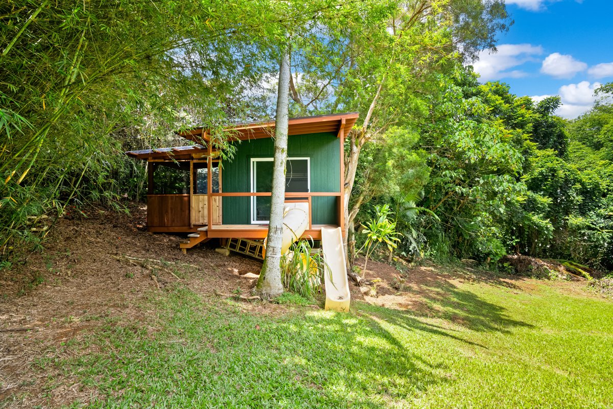 6390 Kalama Road Kapaa, HI 96746 - Photo 14 of 21 front view of a house with a yard