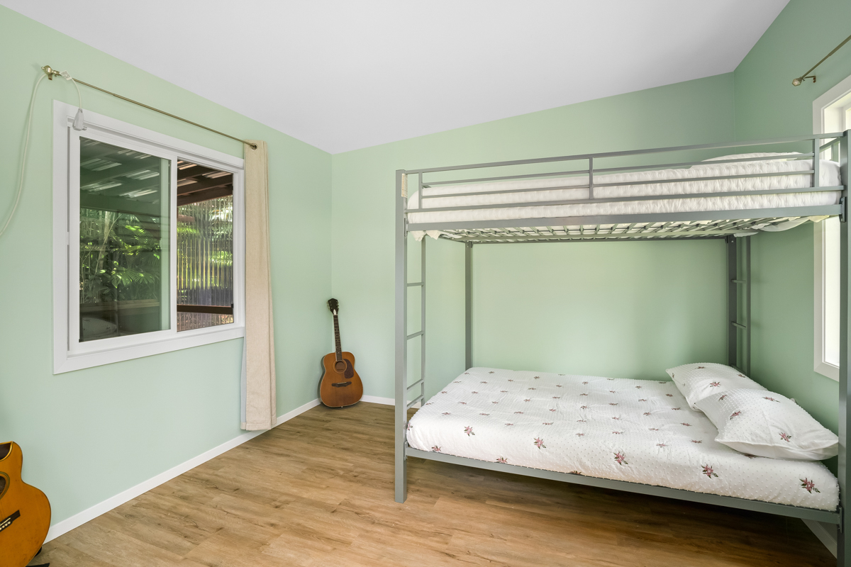 6390 Kalama Road Kapaa, HI 96746 - Photo 15 of 21 a bedroom with a bed and a window