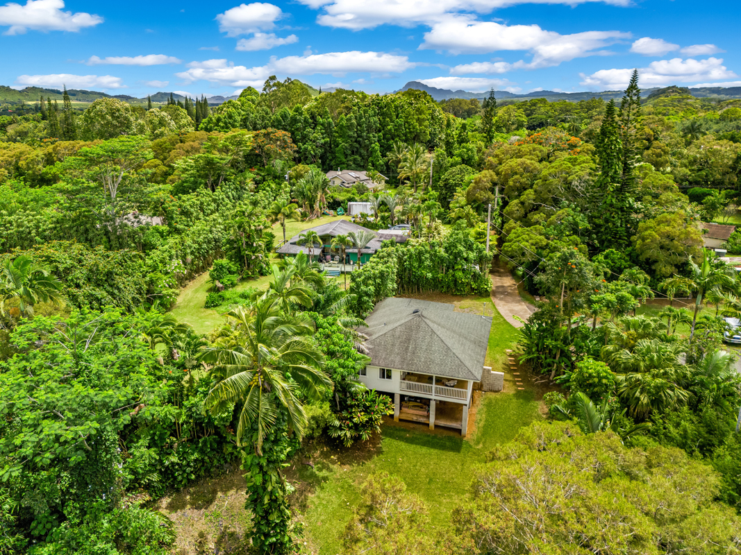 6390 Kalama Road Kapaa, HI 96746 - Photo 2 of 21 a backyard of a house with table and chairs