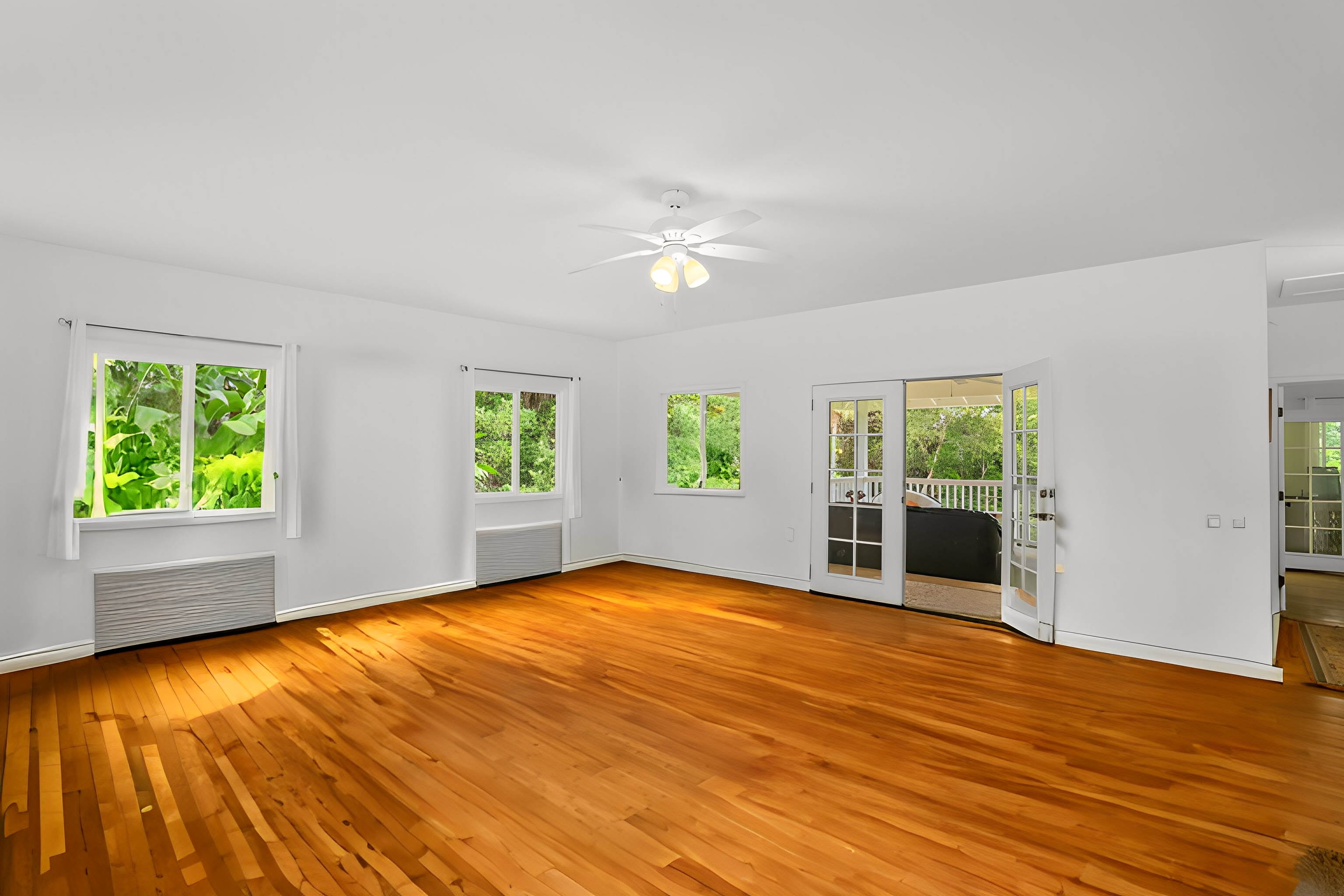 6390 Kalama Road Kapaa, HI 96746 - Photo 4 of 21 a view of empty room with wooden floor and fan