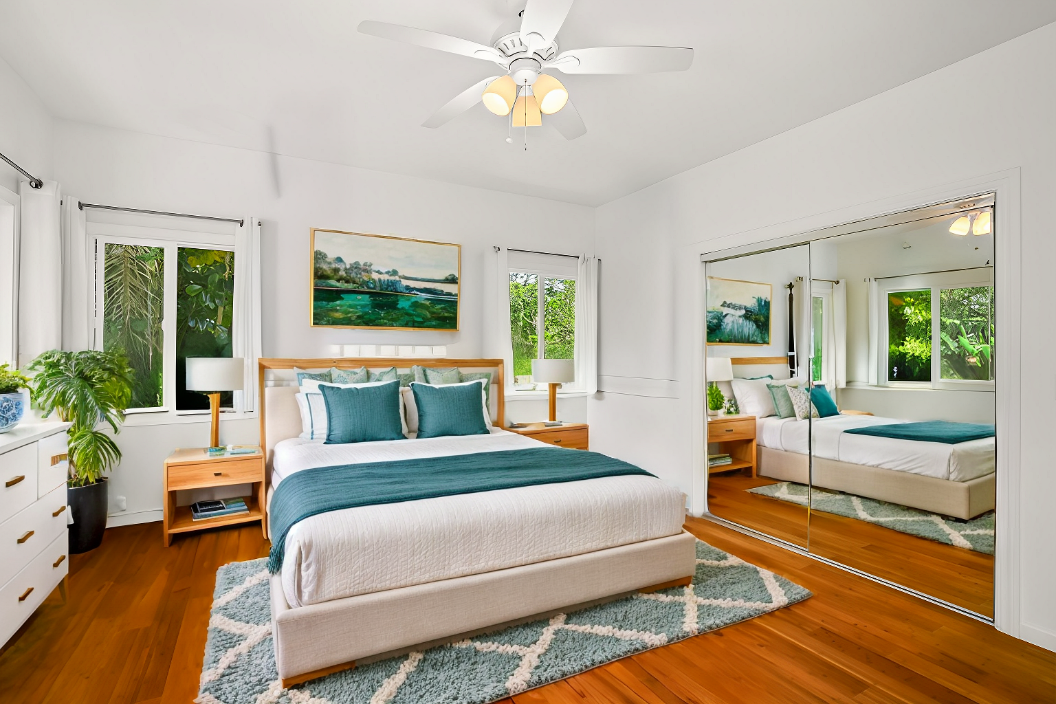 6390 Kalama Road Kapaa, HI 96746 - Photo 8 of 21 a bedroom with a large bed couch and windows