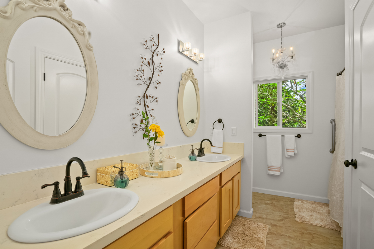 6390 Kalama Road Kapaa, HI 96746 - Photo 10 of 21 a bathroom with a sink and a mirror