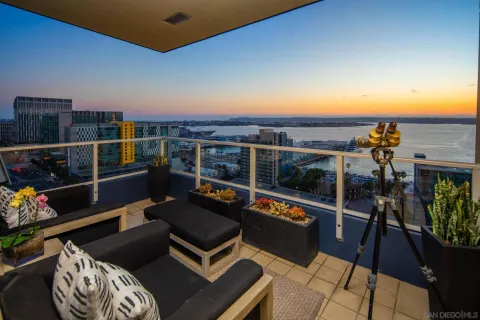 a view of a chairs and table in a balcony
