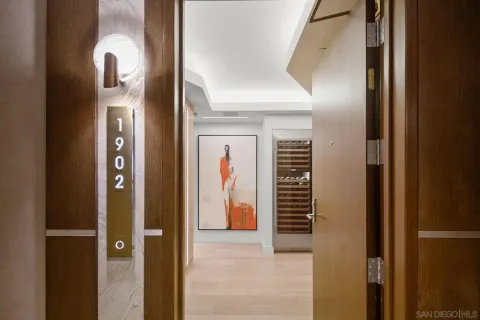 a view of a hallway with paintings on the door