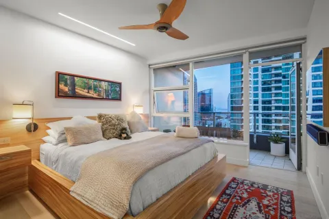 a view of a balcony with wooden floor and iron stairs