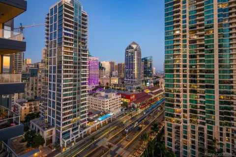 a balcony with hardwood filled with table and chairs