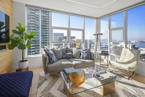 a living room with furniture and a large window
