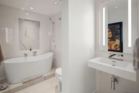 a white bath tub sitting in a bathroom