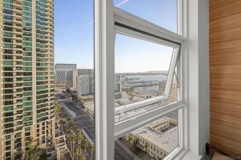 a view of balcony with wooden floor and seating space