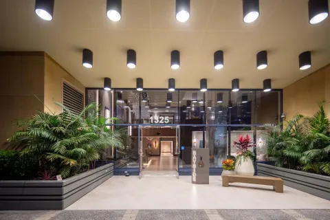 a view of a swimming pool with a bench and trees