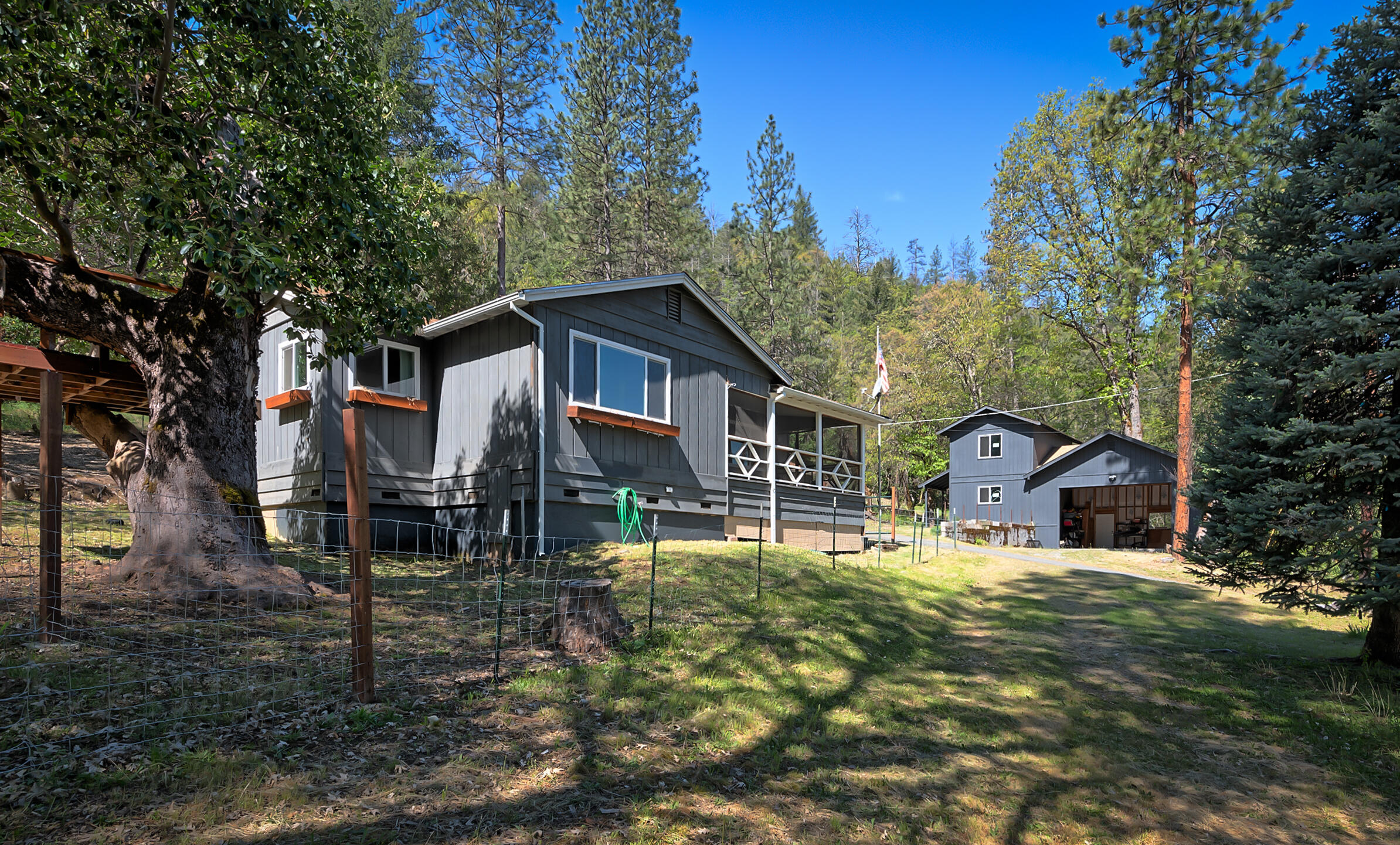 1765 Goose Ranch Road Lewiston, CA 96052 - Photo 15 of 83 a view of a house with backyard porch and sitting area