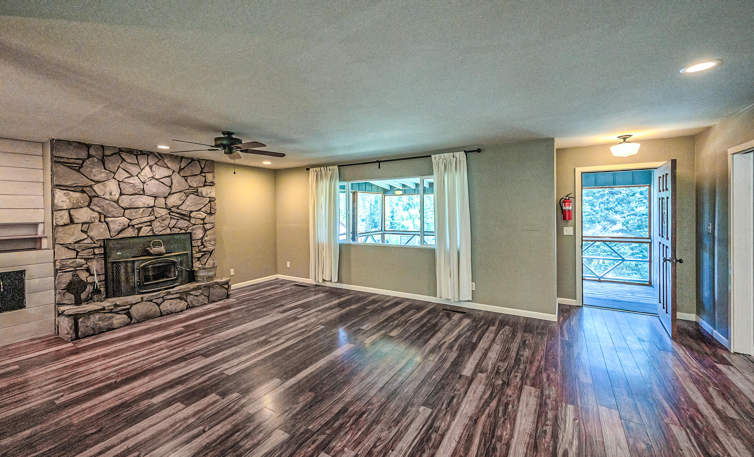 1765 Goose Ranch Road Lewiston, CA 96052 - Photo 18 of 83 a view of an empty room with wooden floor and a window