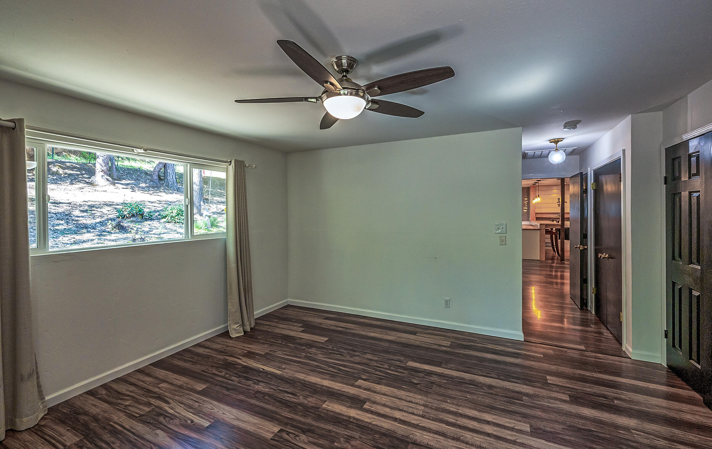 1765 Goose Ranch Road Lewiston, CA 96052 - Photo 29 of 83 a view of empty room with wooden floor and fan