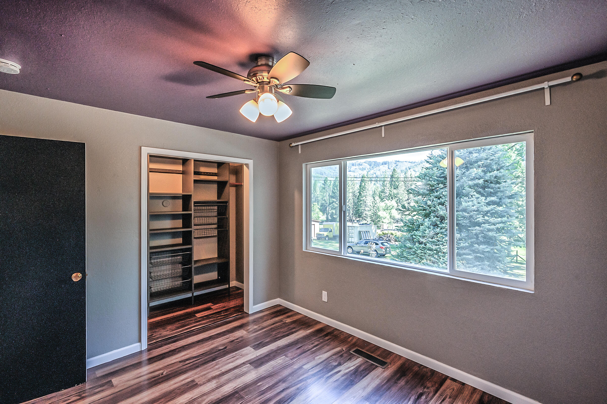 1765 Goose Ranch Road Lewiston, CA 96052 - Photo 42 of 83 a view of an empty room with a window and wooden floor