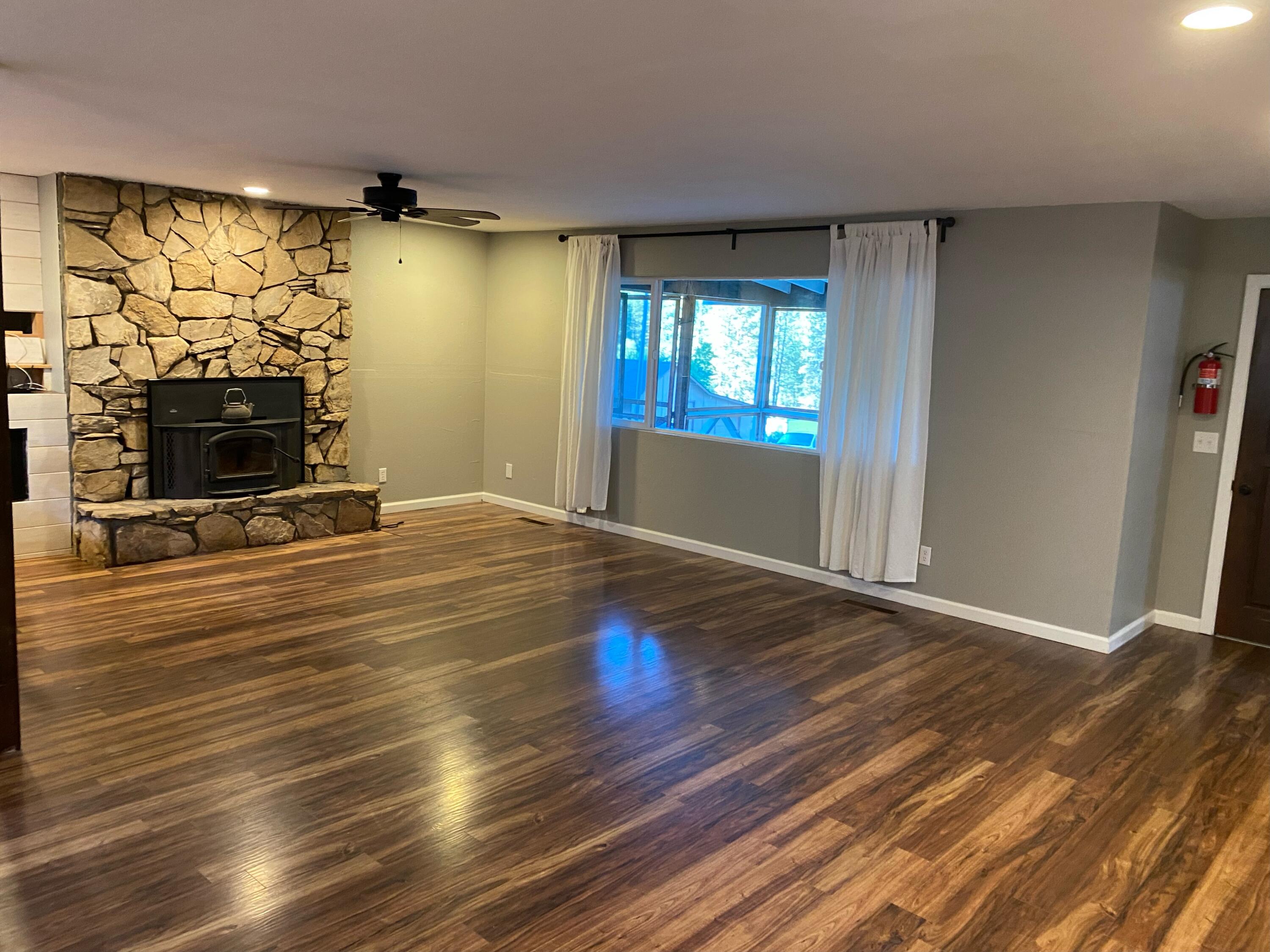 1765 Goose Ranch Road Lewiston, CA 96052 - Photo 56 of 83 a view of empty room with wooden floor and fan