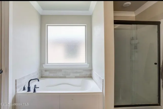 a white bath tub sitting next to a window