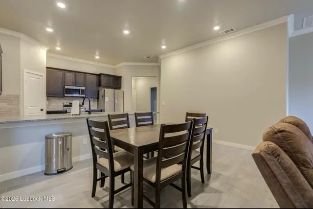 a view of a dining room with furniture