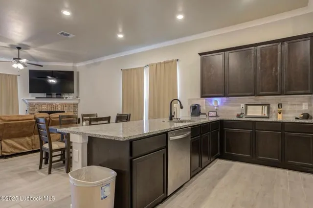a kitchen with a sink cabinets and appliances