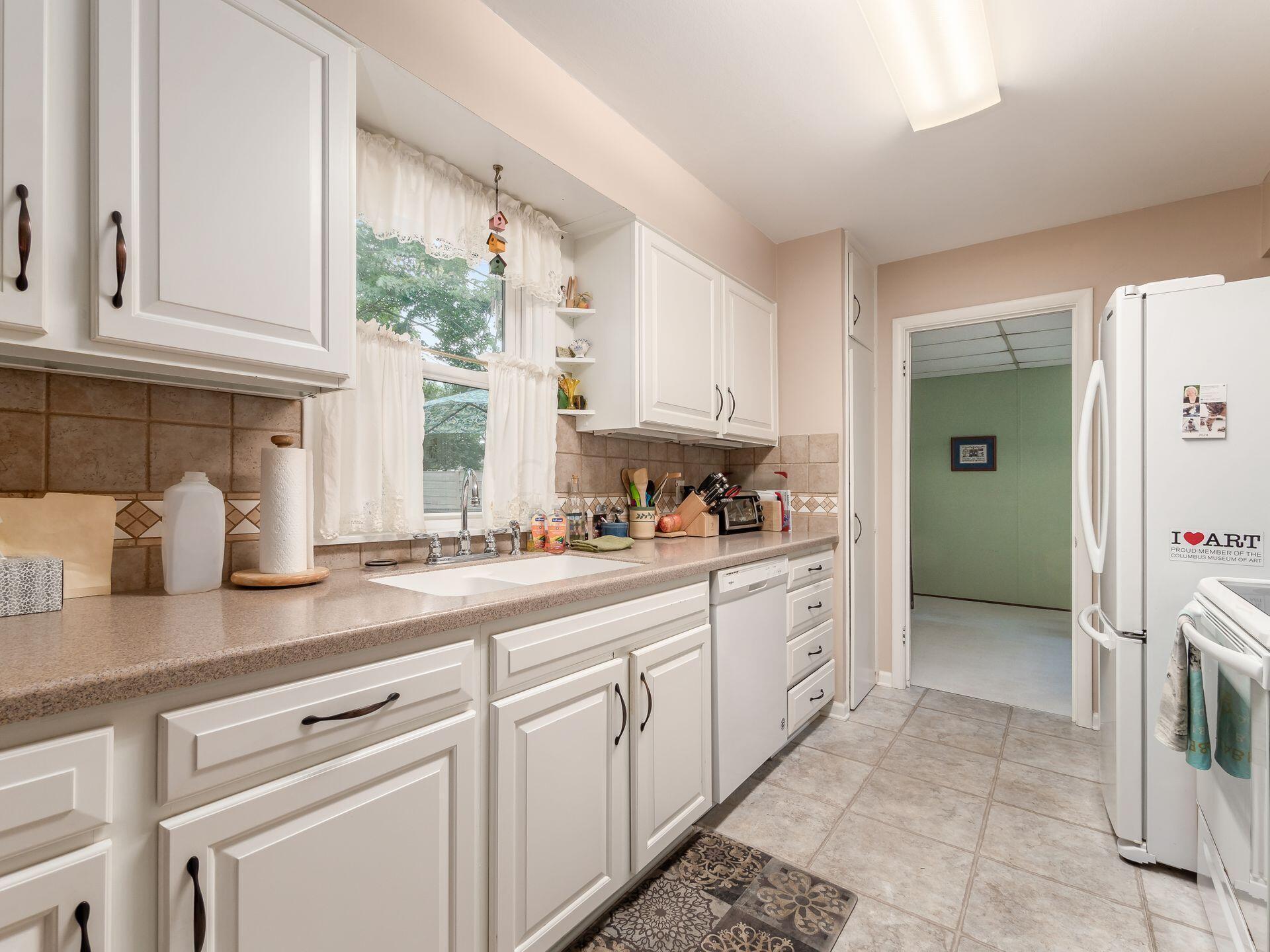 1926 Milden Road Columbus, OH 43221 - Photo 9 of 19 White and bright kitchen