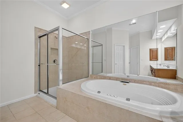a bathroom with a bathtub and a shower